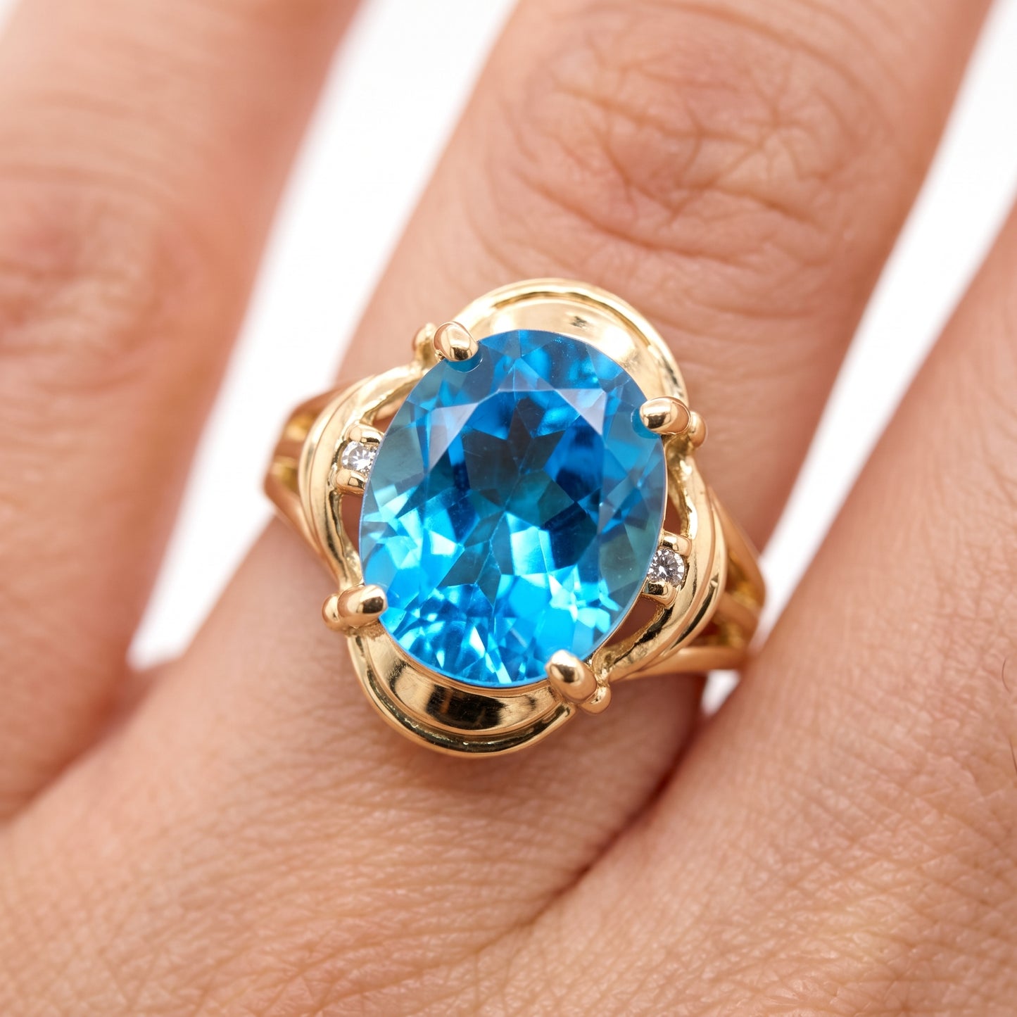 10x12mm Oval Blue Topaz & 2-Diamond Ring