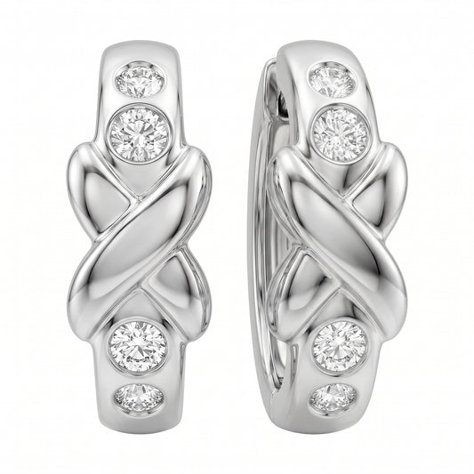 DECA0887W 14K white gold X-design hinged hoop earrings with four bezel-set round diamonds each, angled view