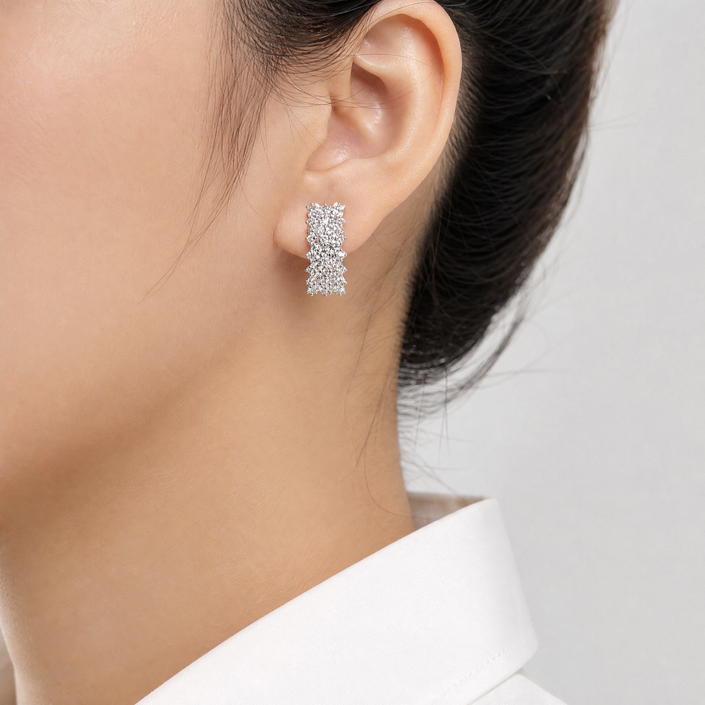 DECY0910W model shot - round diamond multi-row cluster panel clip earring worn on ear
