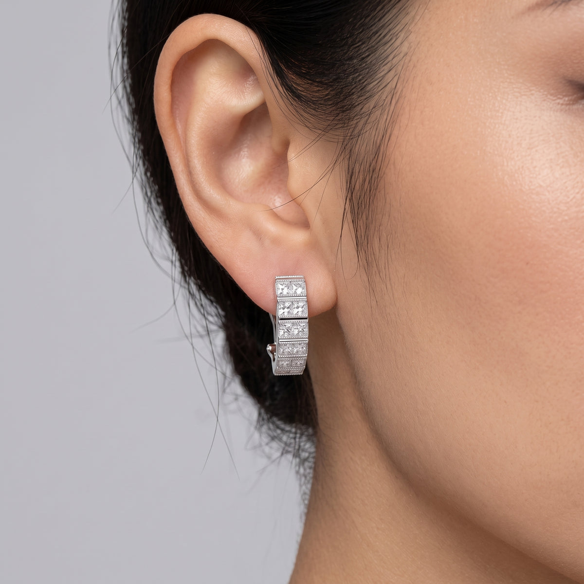 Model wearing Princess-Cut Diamond Milgrain Vertical Clip Earring in 18K white gold