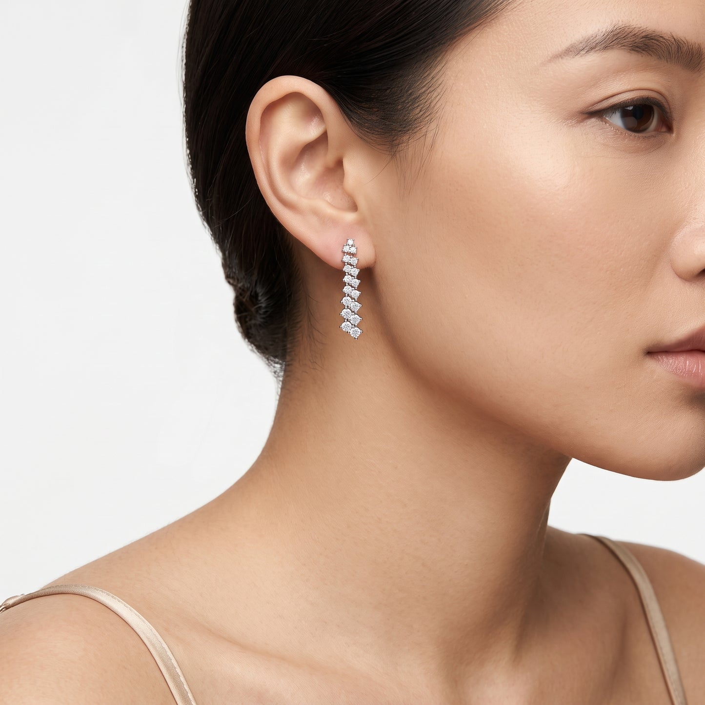 34-Diamond Graduated Dangle Post Earrings - worn on model, 14K white gold graduated round brilliant diamond dangle hanging from the earlobe