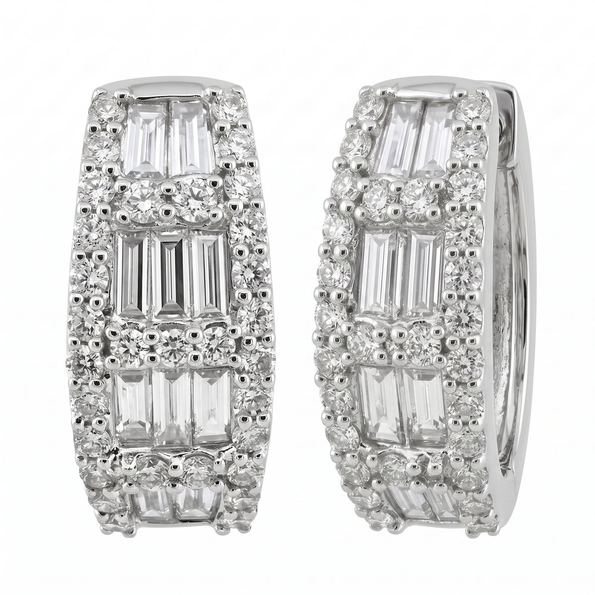 18K white gold baguette and round diamond huggie hoop earrings, angled view showing the hinge and plain inner band, on a white background