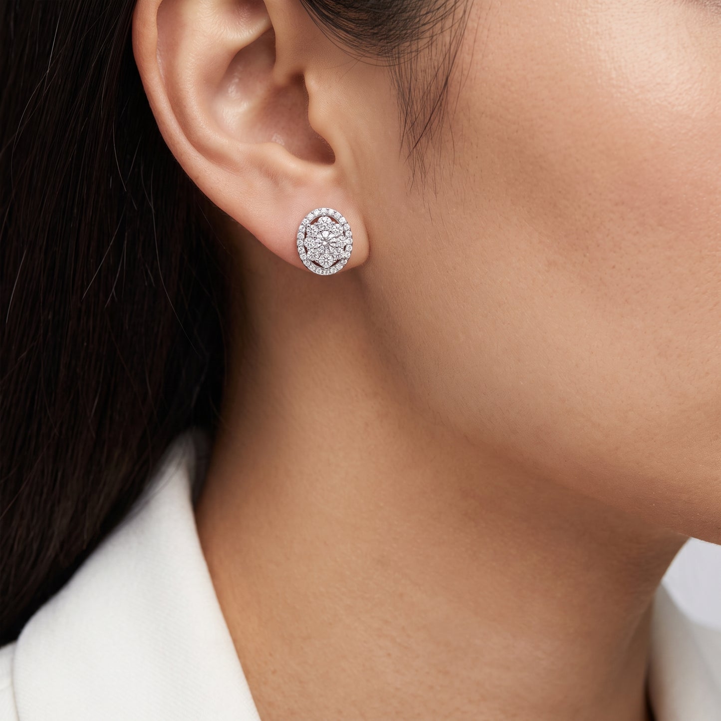 67-Diamond Oval Stud Earrings in 14K white gold worn on the ear