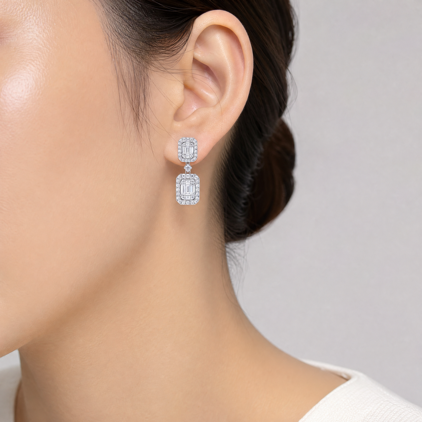 DEM1253W model shot - baguette and round diamond double cluster drop earring worn on ear