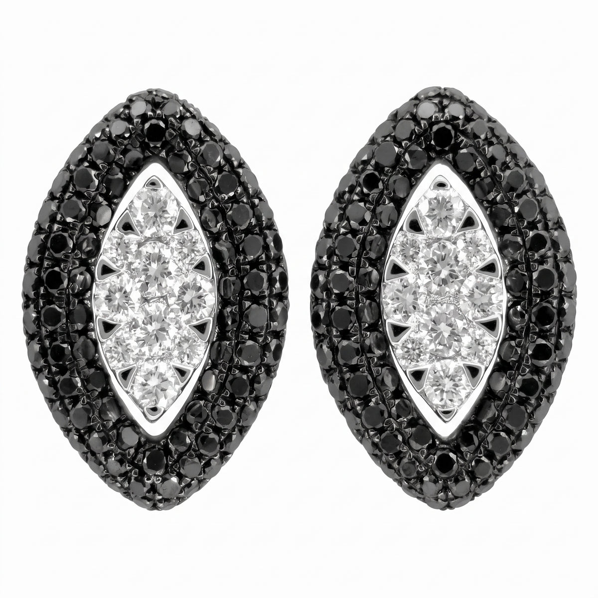 14K white gold black and white diamond marquise stud earrings on a white background