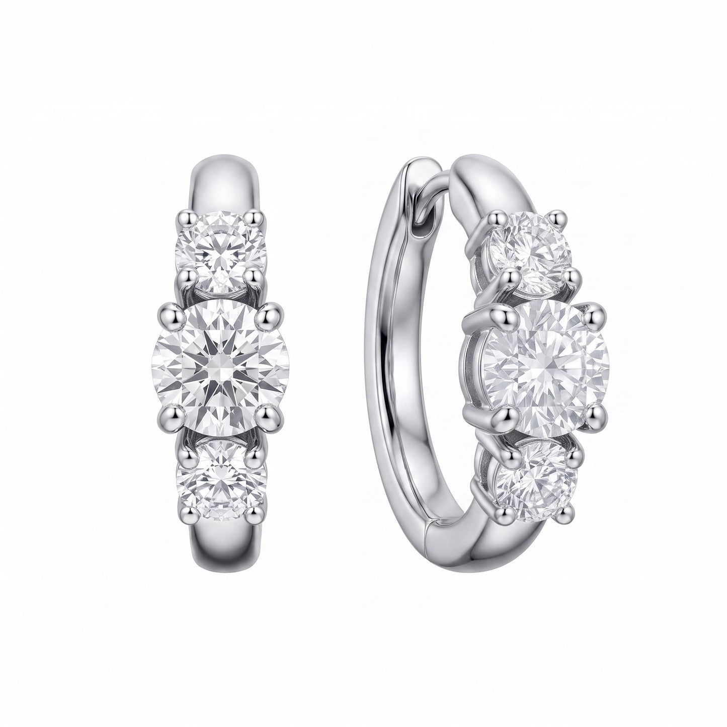 18k white gold three-stone graduated round diamond huggie hoop earrings, front and turned profile view showing the plain rear arc and hinged back, white background