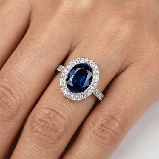 Oval Sapphire and Diamond Milgrain Halo Ring - worn on hand