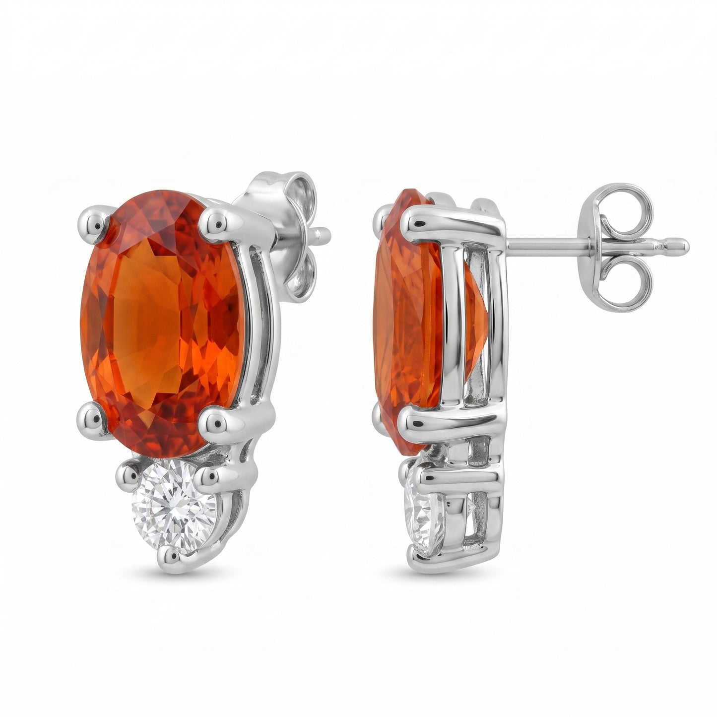 14k white gold oval orange-red sapphire and round diamond post earrings, front and profile view, white background