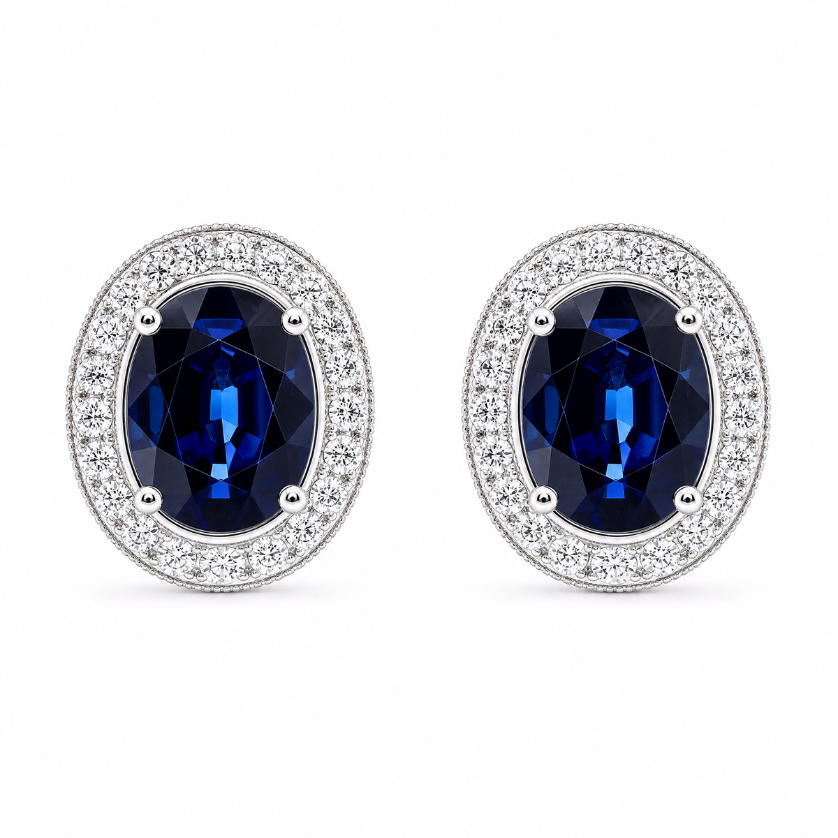 SERT0502W-OV W-1 frontal pair - oval blue sapphire with milgrain diamond halo stud earrings in 18K white gold