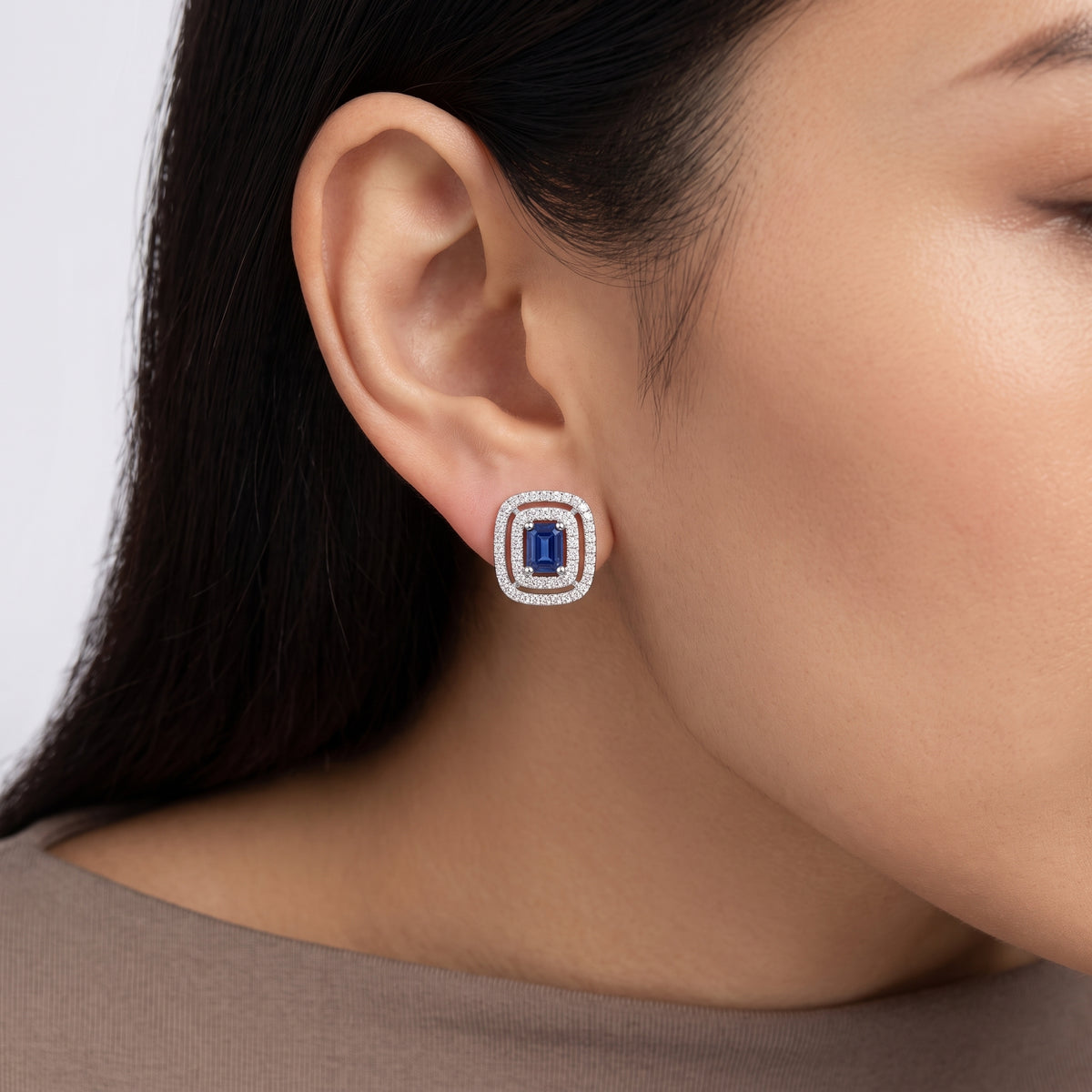 Model wearing Blue Sapphire Double Halo Diamond Stud Earring in 14K white gold