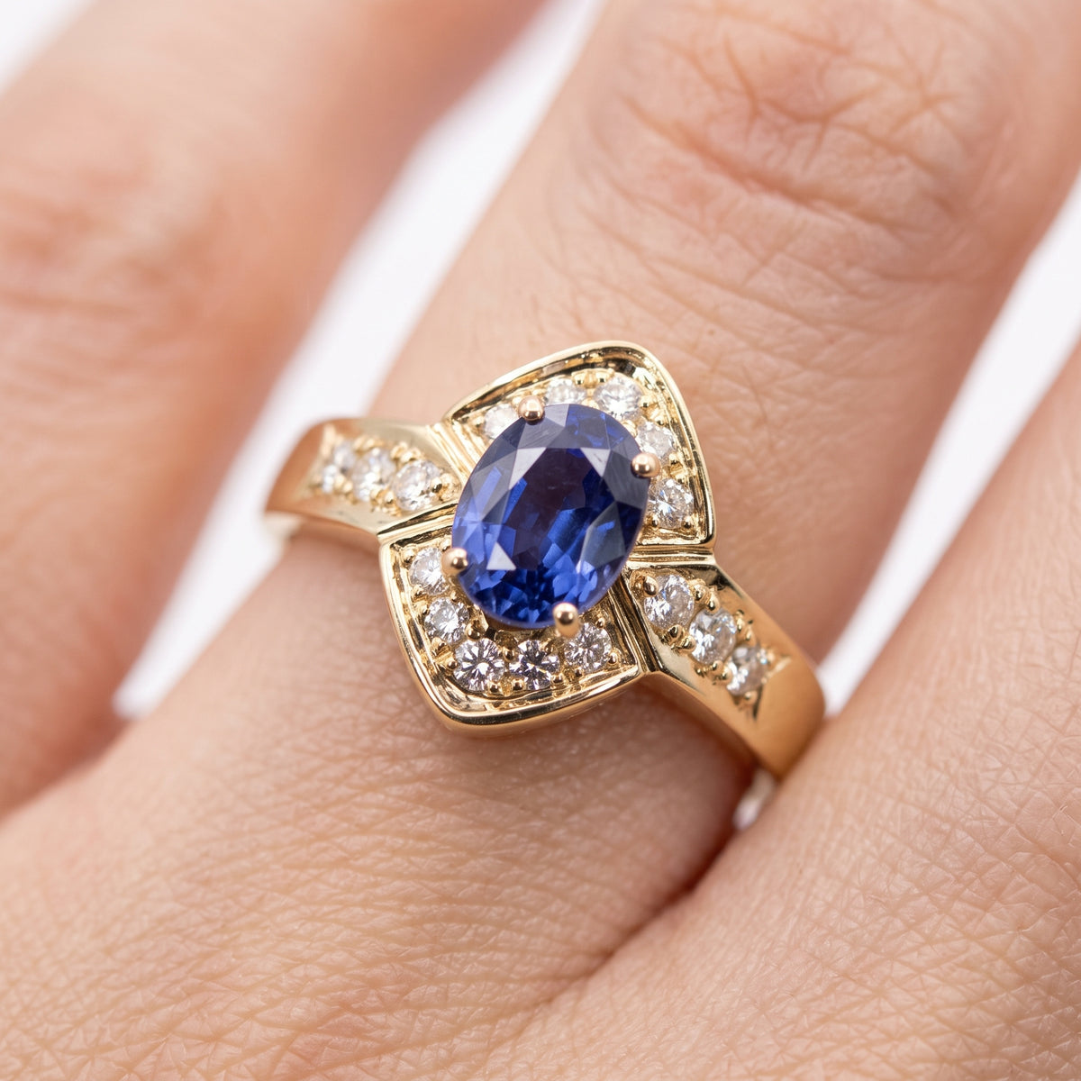 5x7mm Oval Tanzanite & 16-Diamond Ring