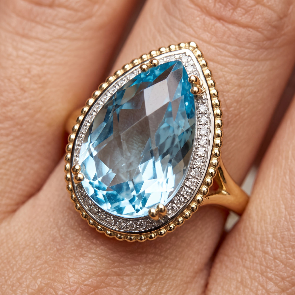 10x16mm Checkerboard-Cut Pear Sky Blue Topaz & 27-Diamond Rope Edge Ring