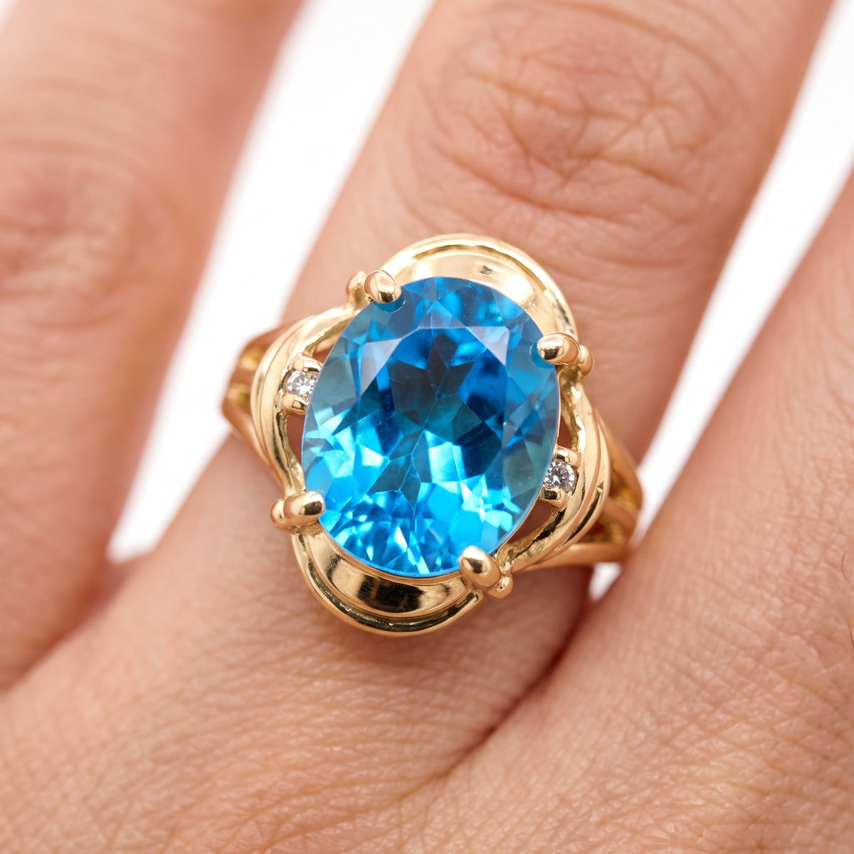 10x12mm Oval Blue Topaz & 2-Diamond Ring