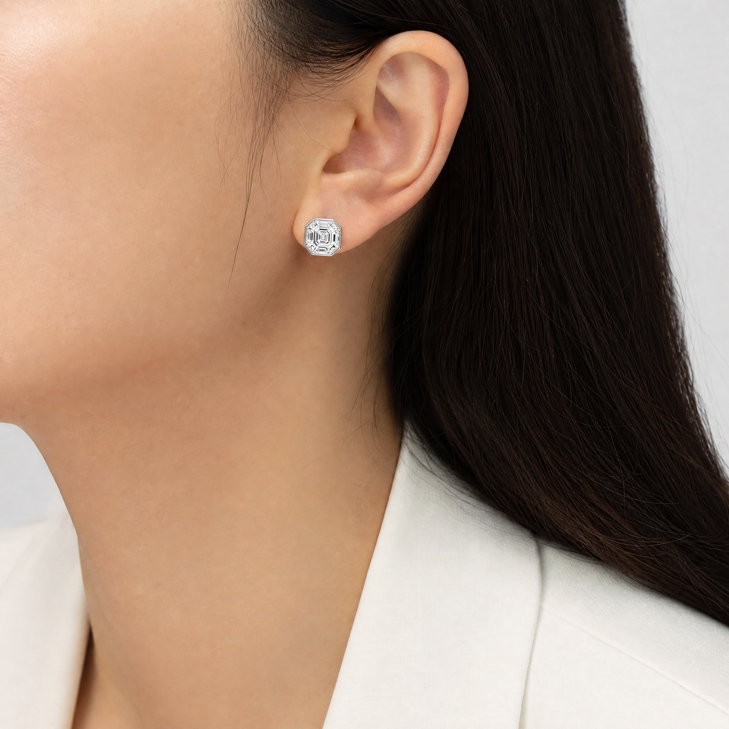 DECA1707W model shot - asscher-style illusion-set octagonal diamond stud earring worn on ear