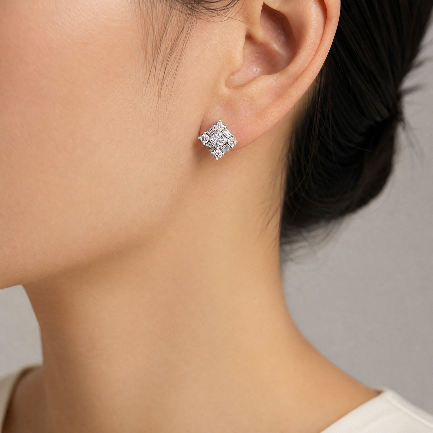 DECY0667W model shot - invisible-set princess and baguette diamond square cluster stud earring worn on ear