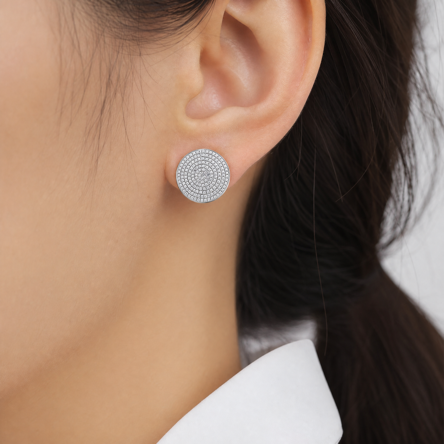 DECY0935W model shot - full pave diamond round disc clip earring worn on ear