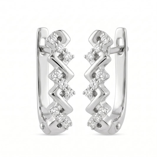 DEFT0618W 14K white gold zigzag chevron huggie hoop earrings with prong-set round diamonds, angled view