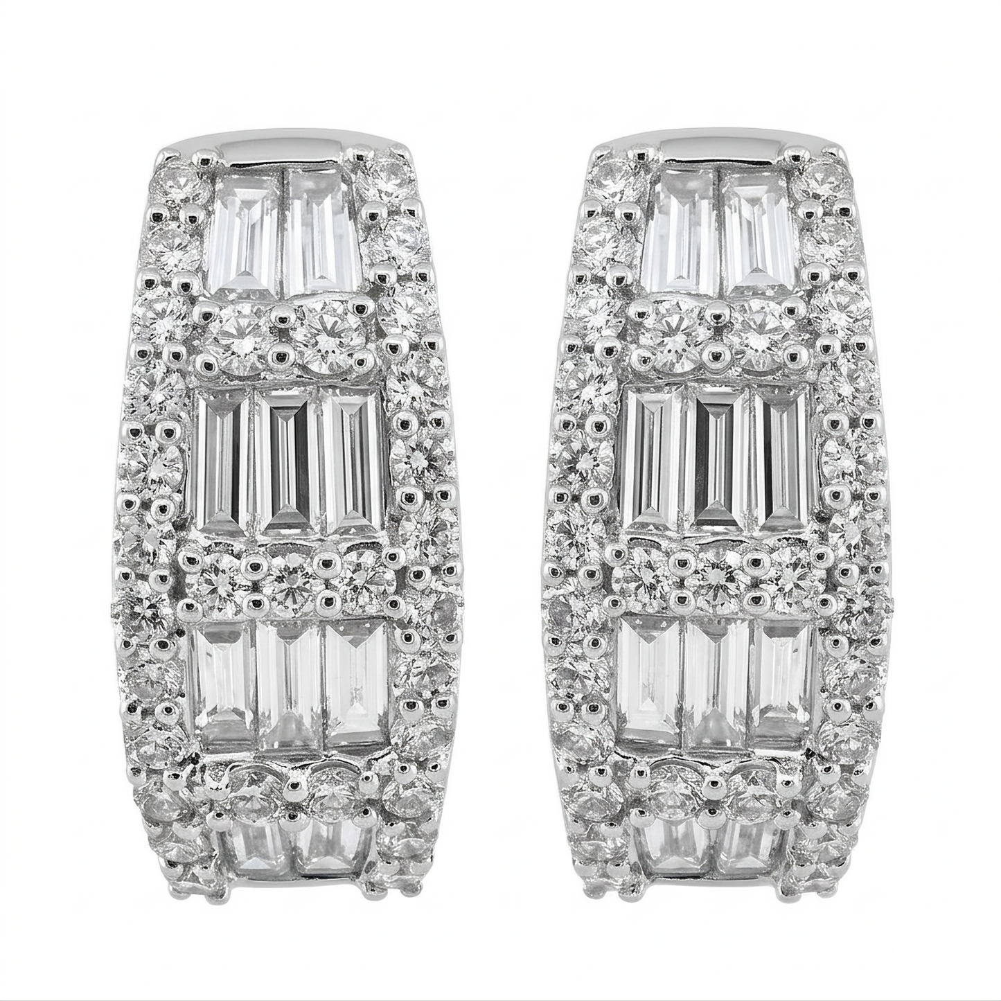 18K white gold baguette and round diamond huggie hoop earrings on a white background