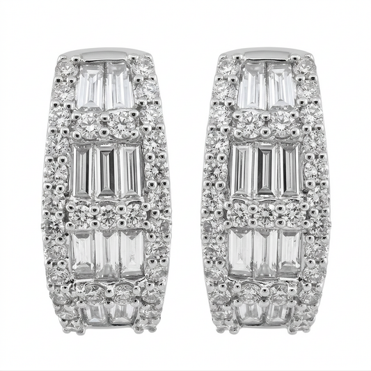 18K white gold baguette and round diamond huggie hoop earrings on a white background