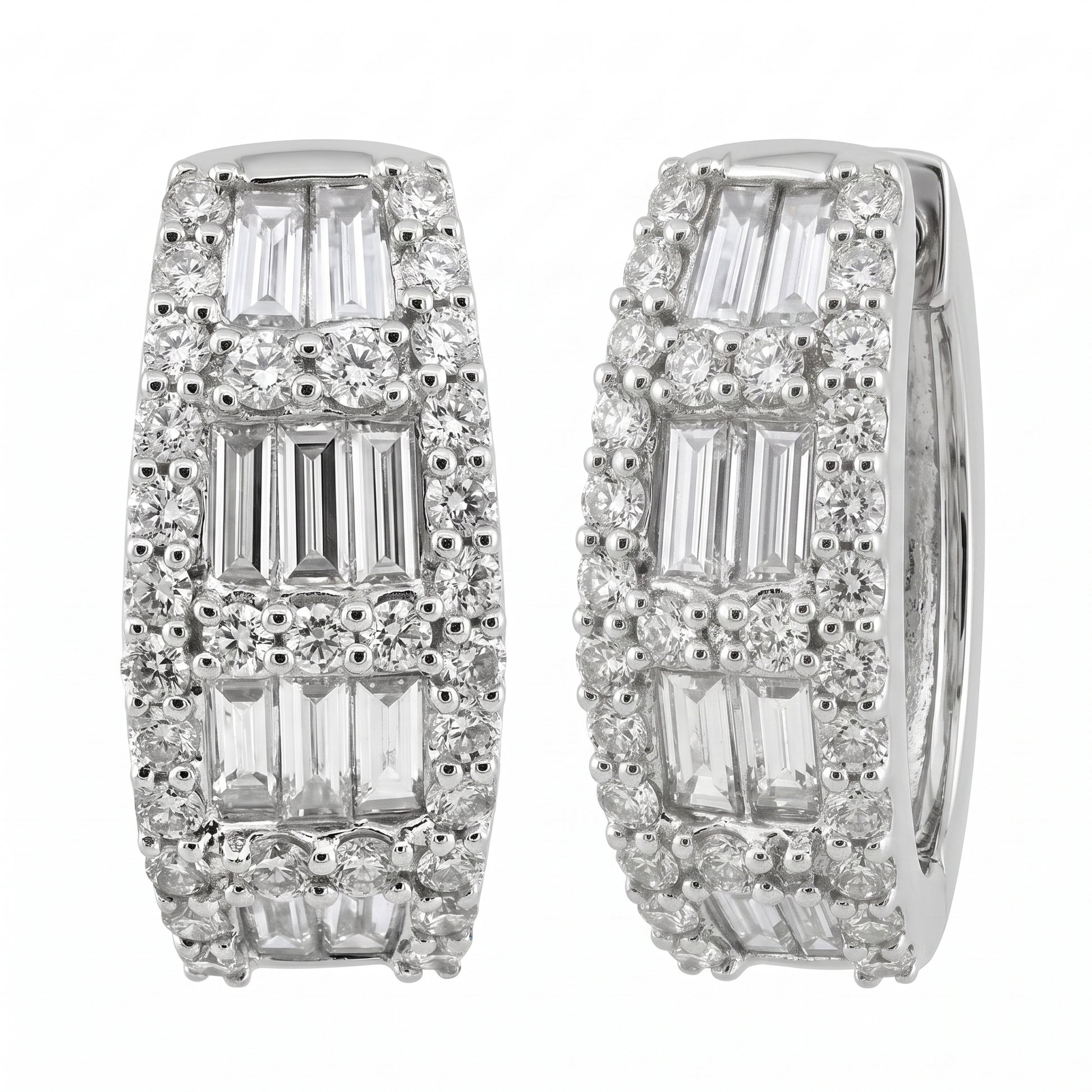 18K white gold baguette and round diamond huggie hoop earrings, angled view showing the hinge and plain inner band, on a white background