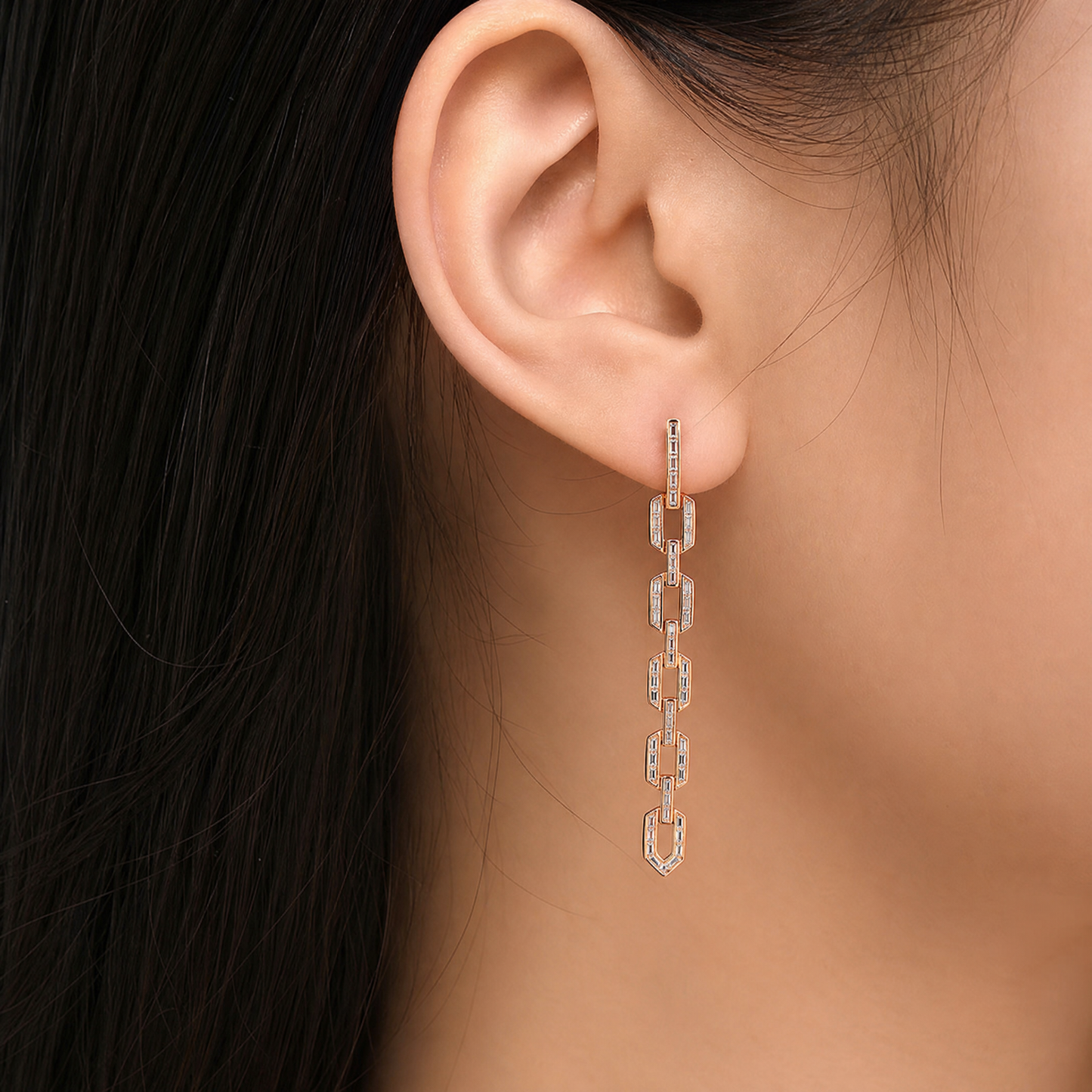 DEPJ0029 model shot - baguette and princess-cut diamond channel dangle clip earring worn on ear