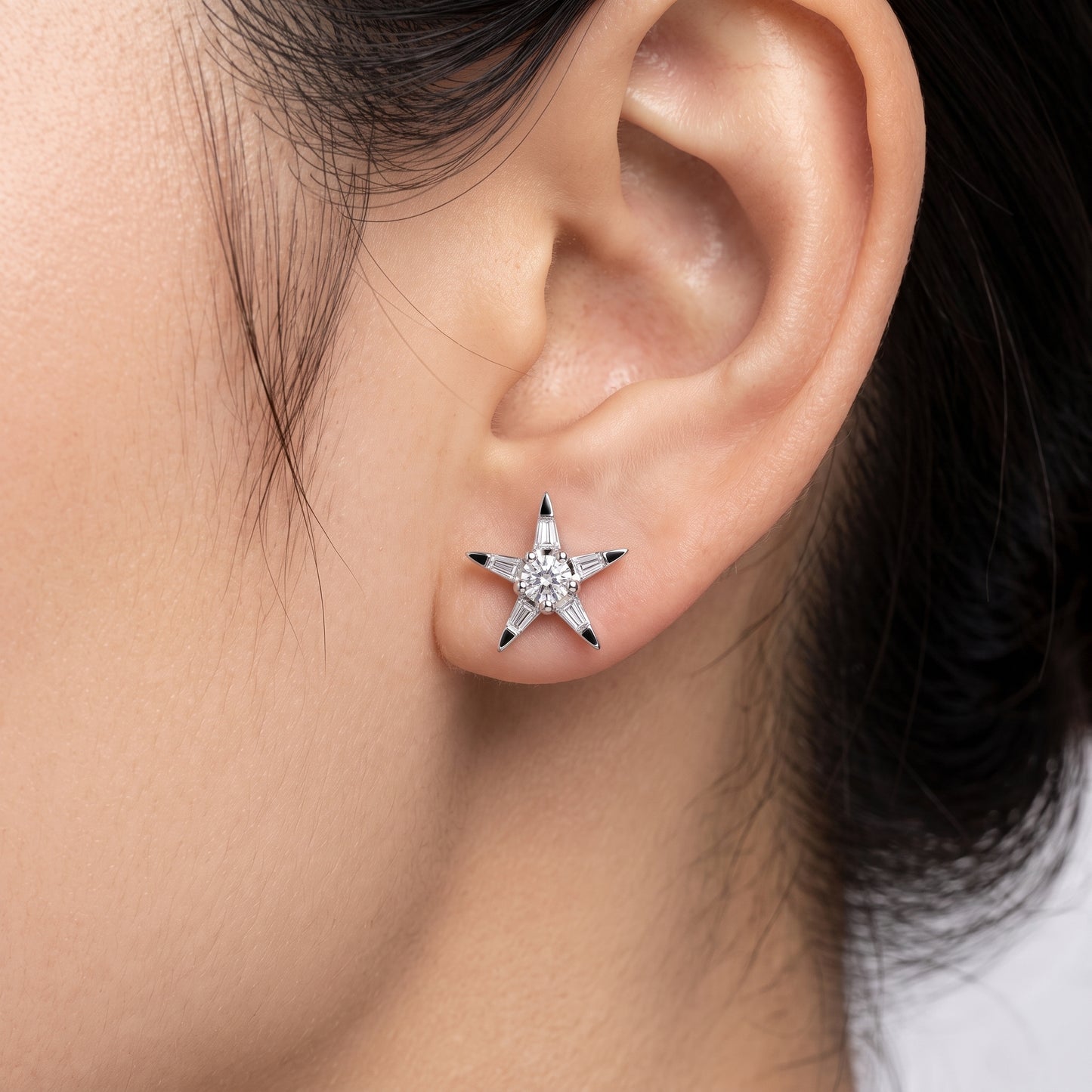 12-Diamond Star Stud Earrings in 18K white gold shown worn on the ear