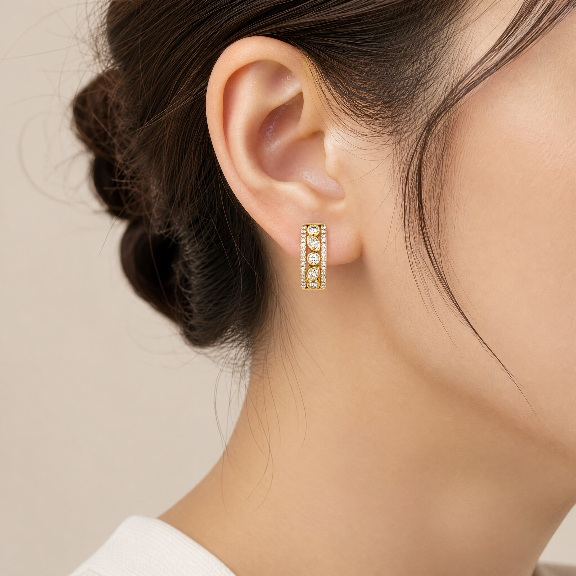 DERT0990 model shot - marquise and round diamond alternating huggie hoop earring in 14K yellow gold worn on ear