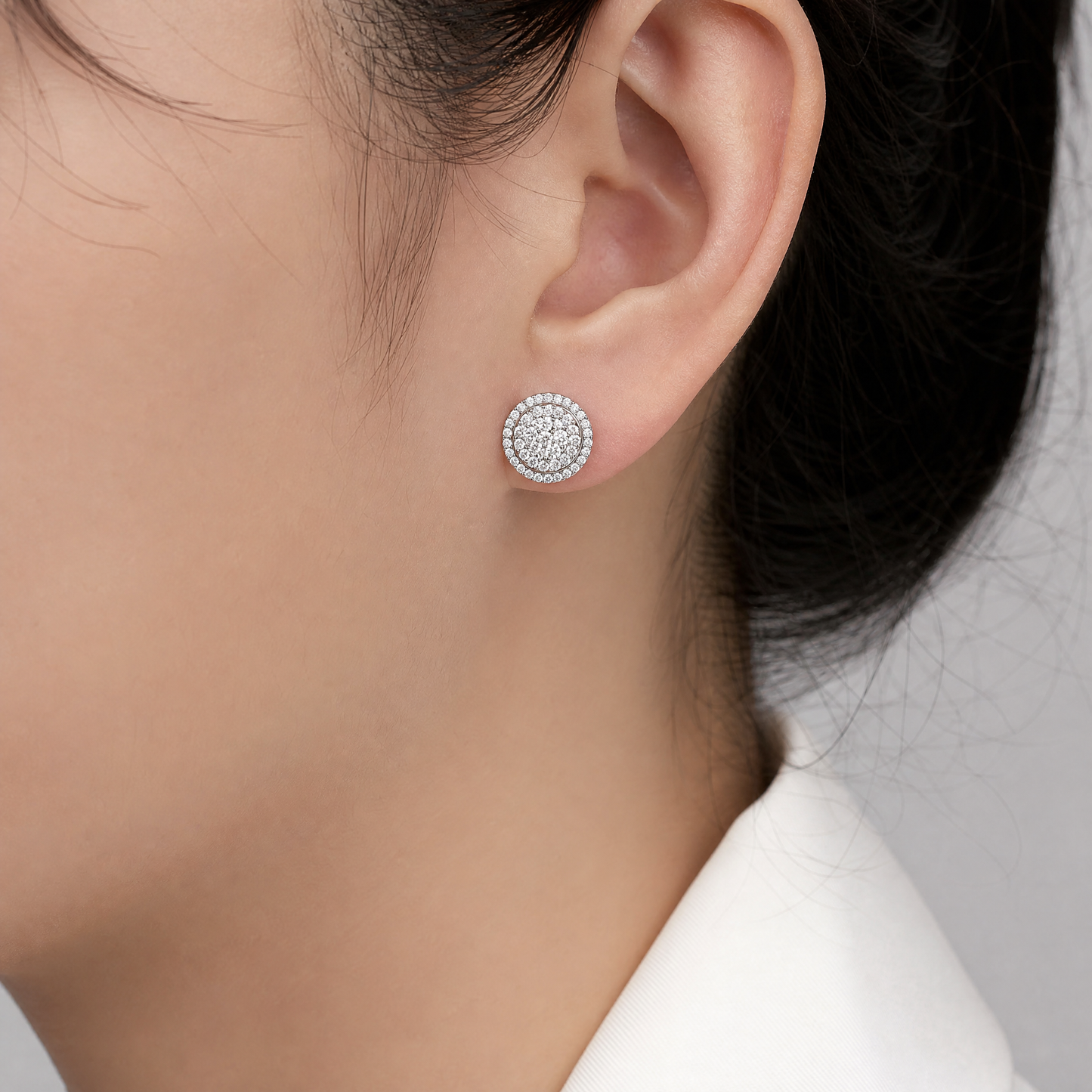 DES1005W model shot - round brilliant diamond pave disc stud earring worn on ear