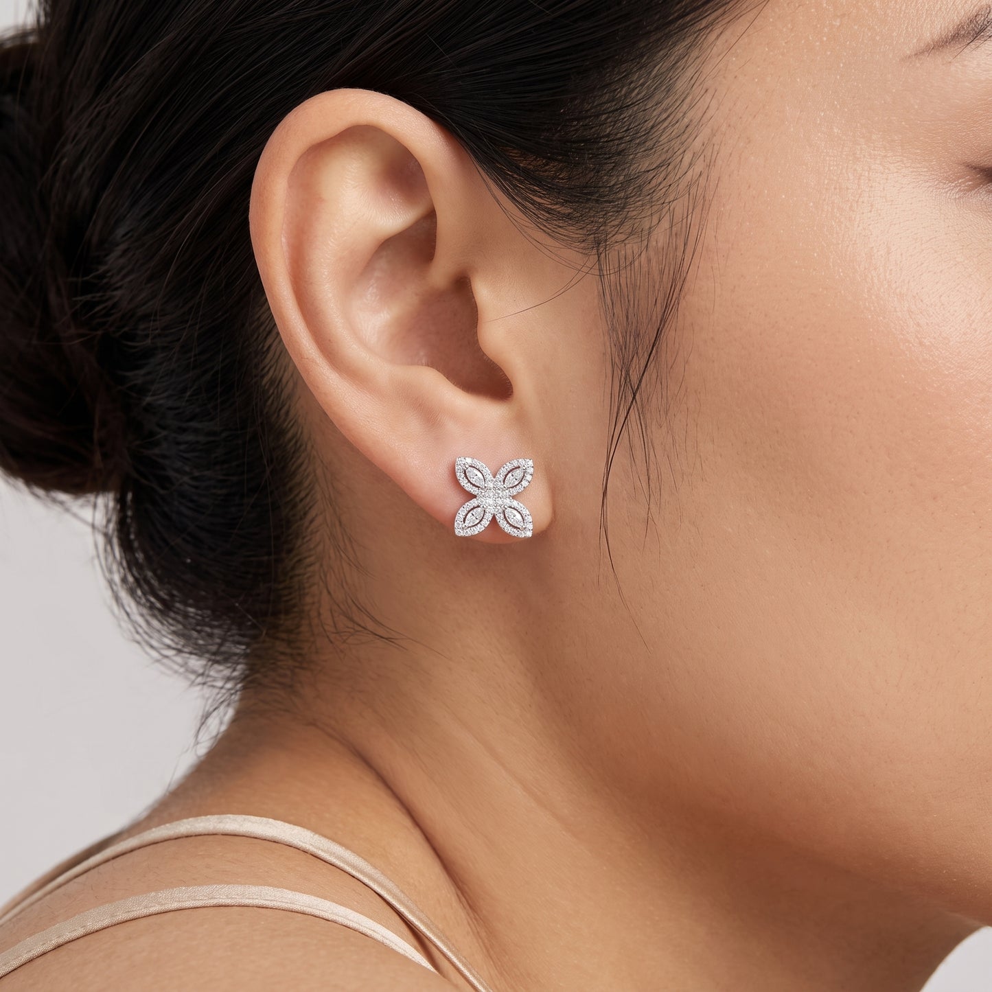 Marquise & Round Diamond Starburst Stud Earrings in 18K white gold shown worn on the ear