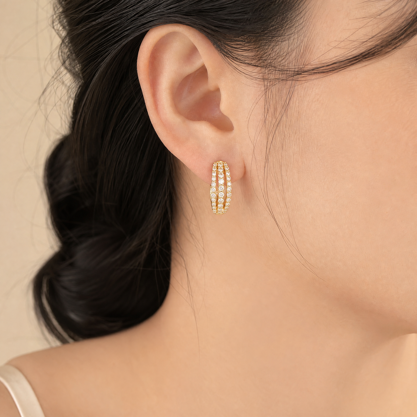 DESD0065 model shot - 3-row round diamond hoop huggie earring worn on ear
