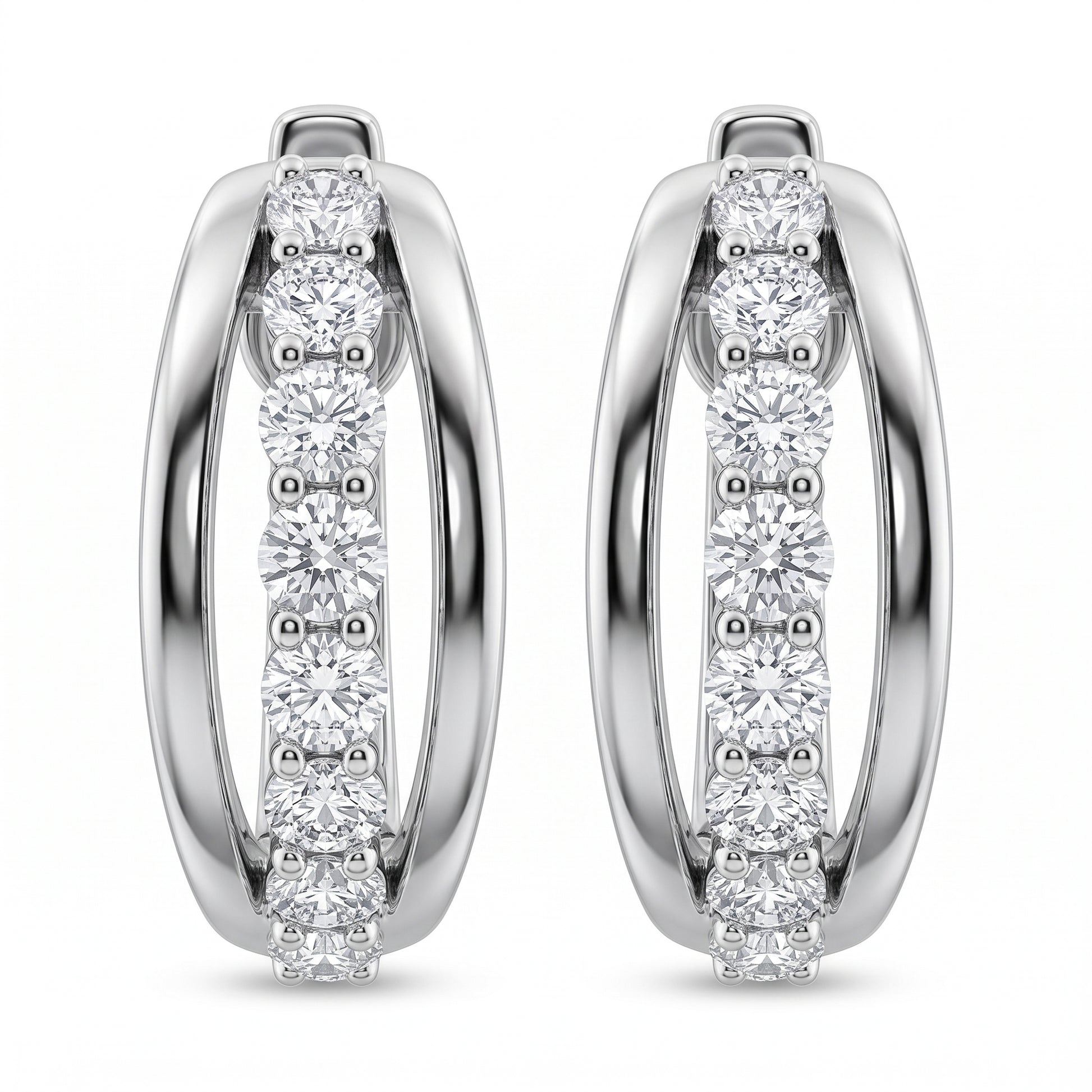 18-Diamond Oval Hoop Earrings - 14k white gold oval huggie hoops bead-set with 9 round diamonds along the front arc of each earring