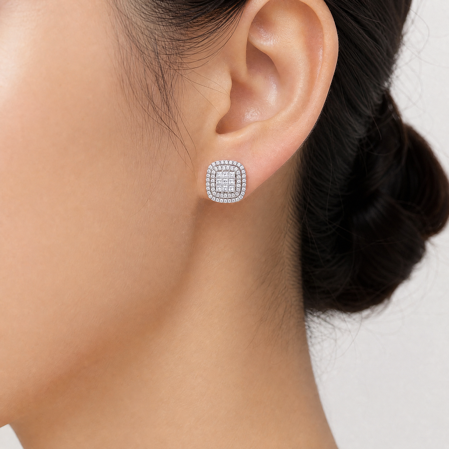 DETE0618W model shot - invisible-set princess-cut diamond double-halo cushion stud earring worn on ear