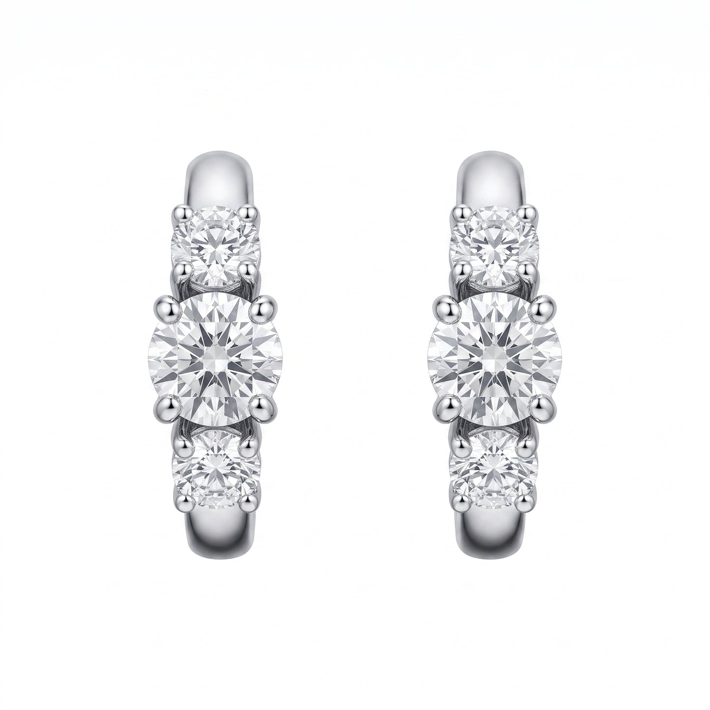 18k white gold three-stone graduated round diamond huggie hoop earrings, white background