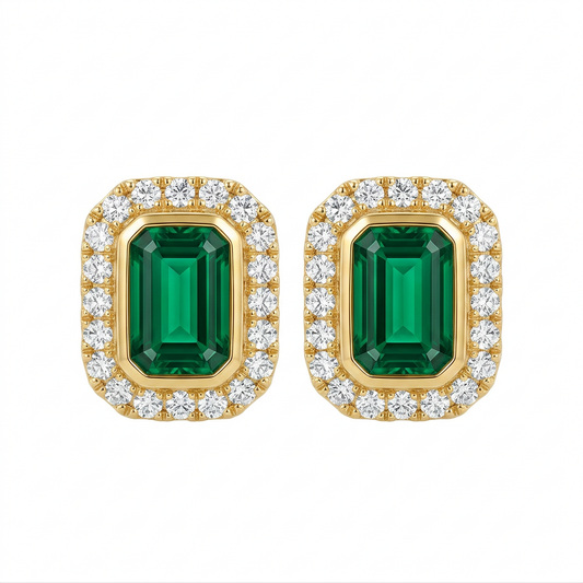4x6mm Emerald-Cut Emerald & Diamond Halo Stud Earrings - 14K yellow gold bezel-set emerald-cut emerald framed by a single row of round brilliant diamonds, white background