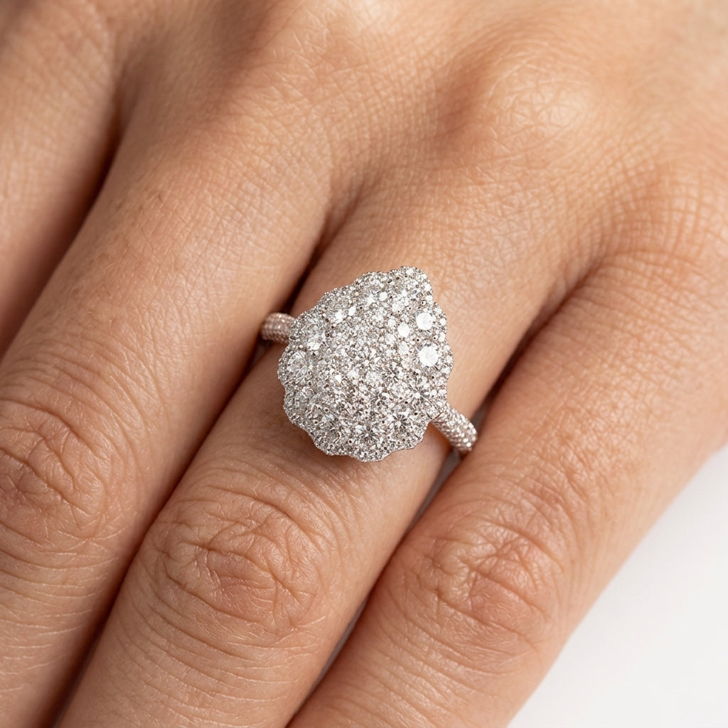 Model wearing 18K white gold pear-shaped diamond pave cluster ring