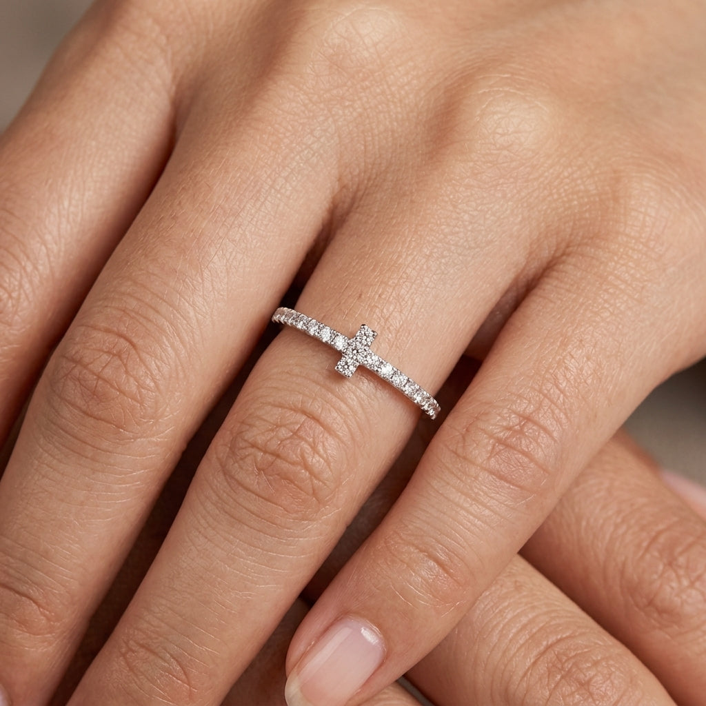 Model wearing 18K white gold diamond cross band ring