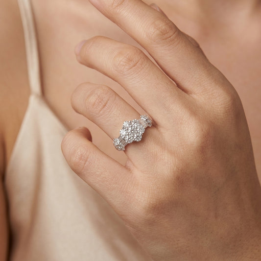 Model wearing 18K white gold diamond flower cluster ring
