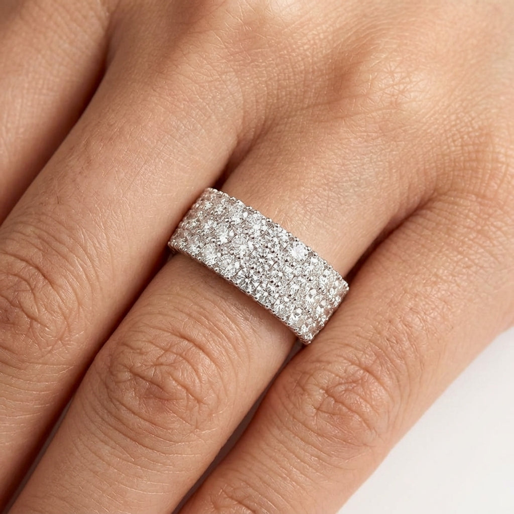 Model wearing 18K white gold three-row diamond wide band ring