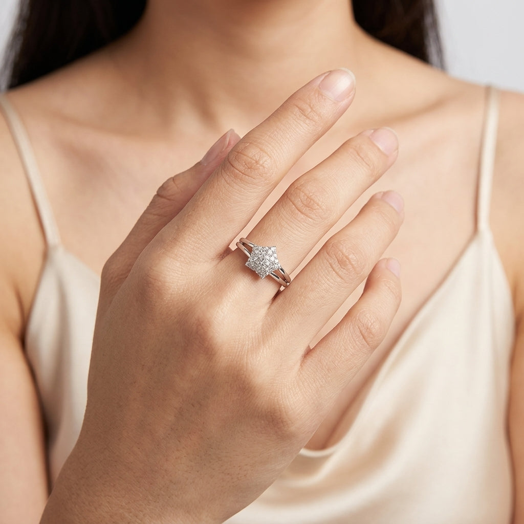 Model wearing 18K white gold diamond pave star ring