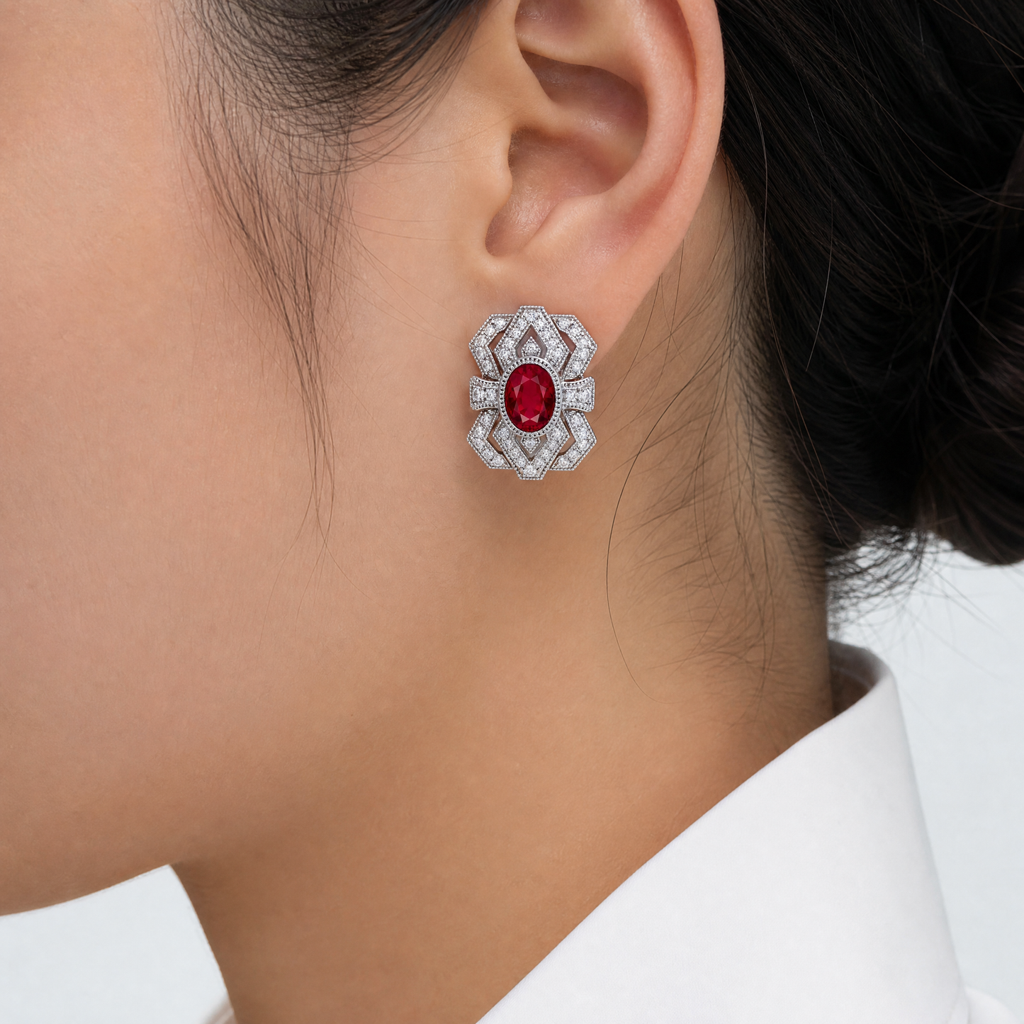 RECY0243W model shot - oval ruby and diamond Art Deco openwork filigree clip earring worn on ear
