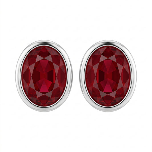 14k and 18k white gold 5x6mm oval ruby bezel-set earrings, white background