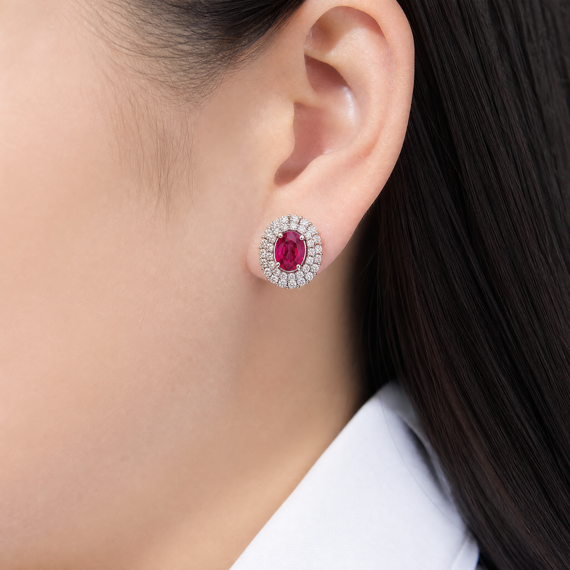 RERT0711W model shot - oval ruby double-halo diamond clip earring worn on ear