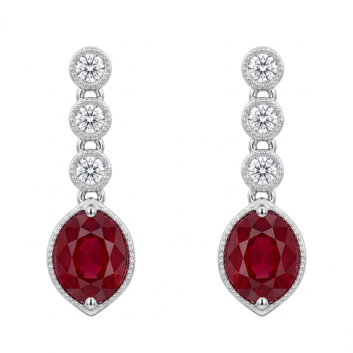 Oval ruby and bezel-set diamond drop earrings in 14K white gold, front view on white