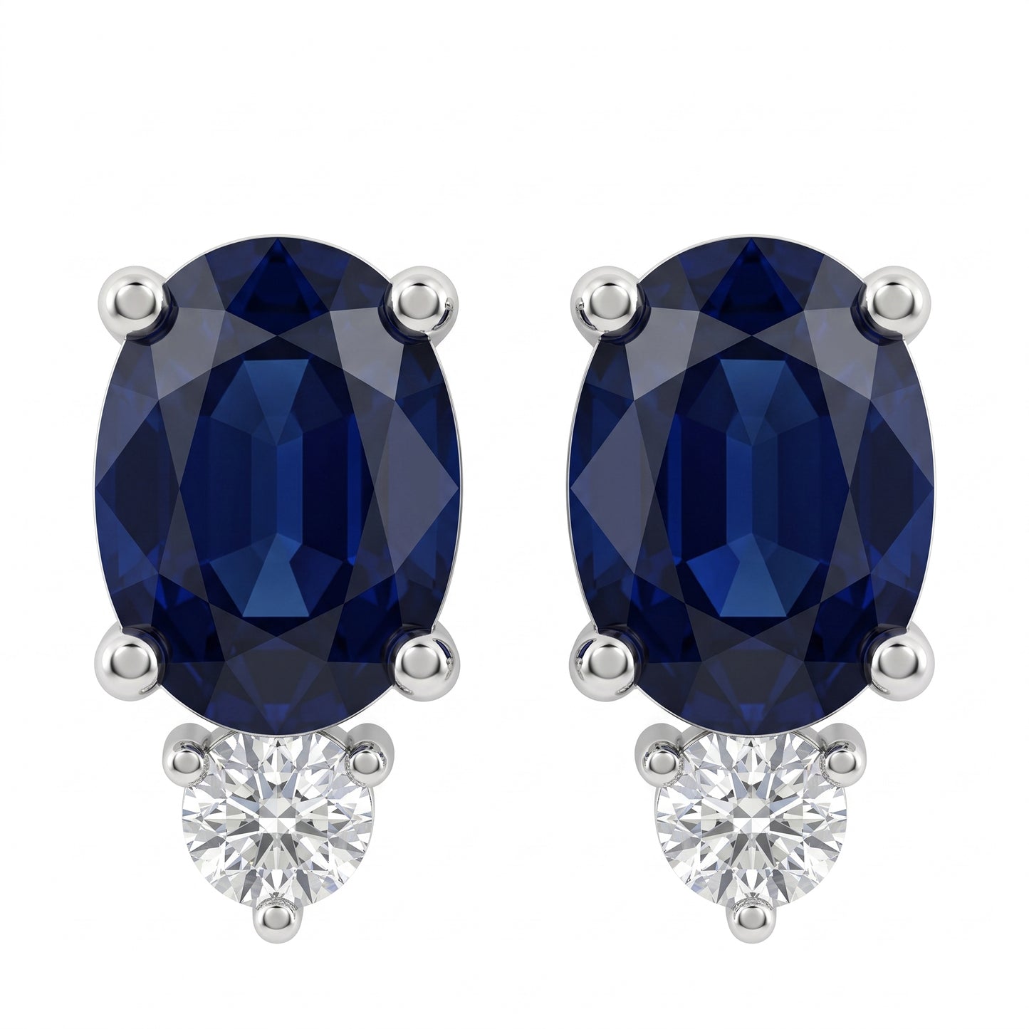 SECA0658W-68 W-1 frontal pair - oval blue sapphire stud earrings, one 6x8mm oval sapphire per earring in four slim prongs with a single round brilliant colourless diamond accent below, in 14K white gold