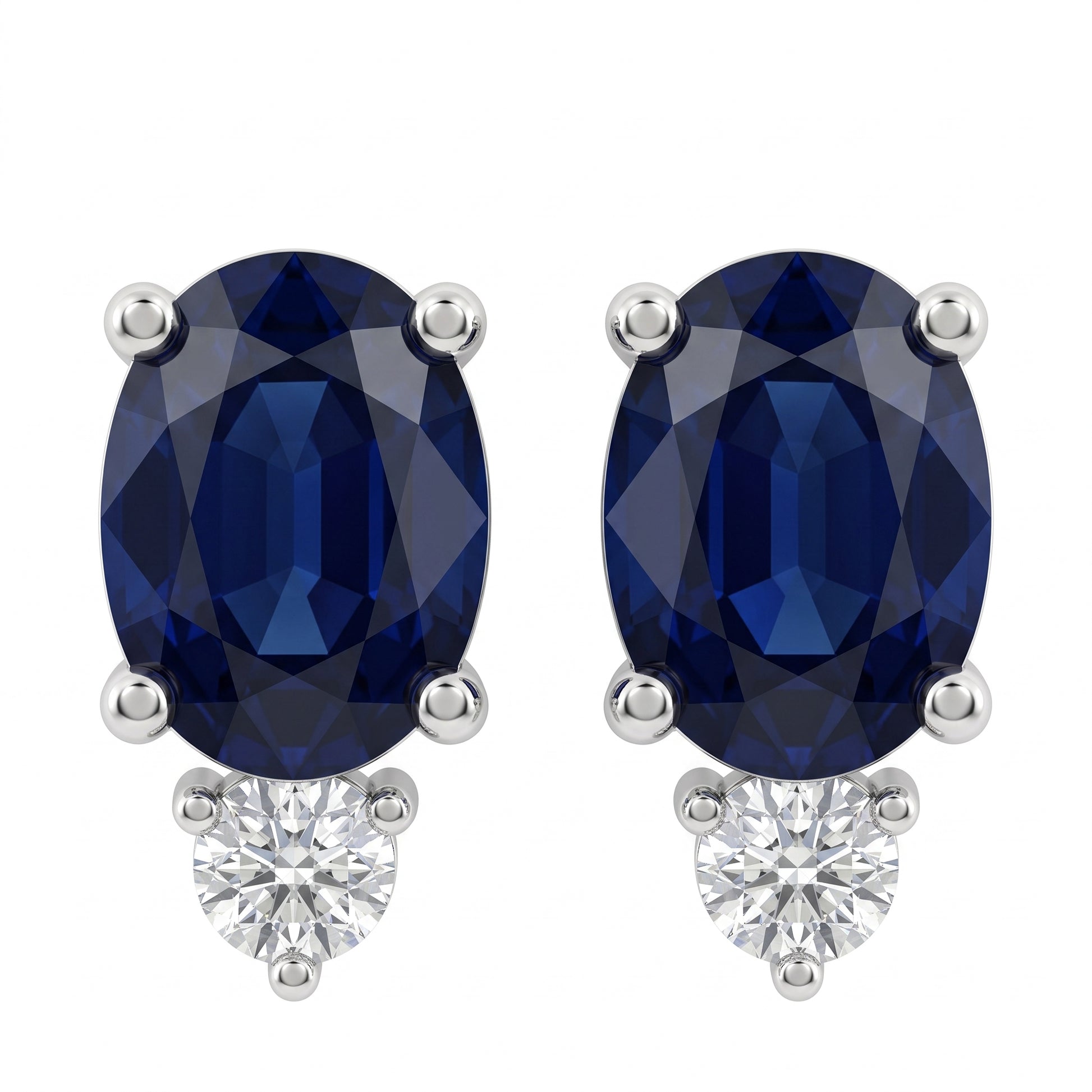 SECA0658W-68 W-1 frontal pair - oval blue sapphire stud earrings, one 6x8mm oval sapphire per earring in four slim prongs with a single round brilliant colourless diamond accent below, in 14K white gold