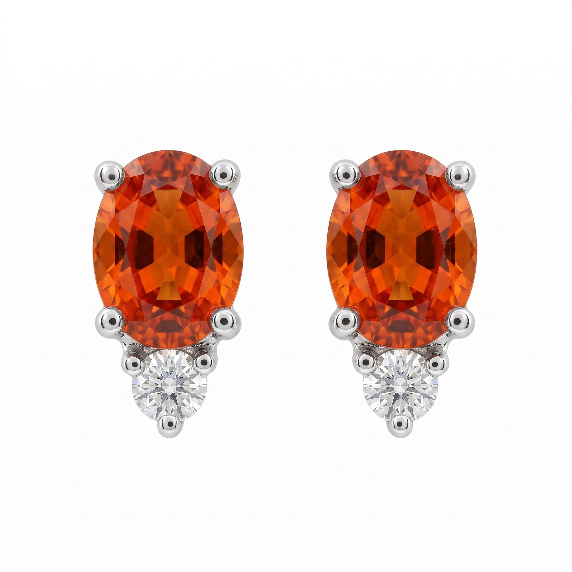 14k white gold oval orange-red sapphire and round diamond post earrings, white background