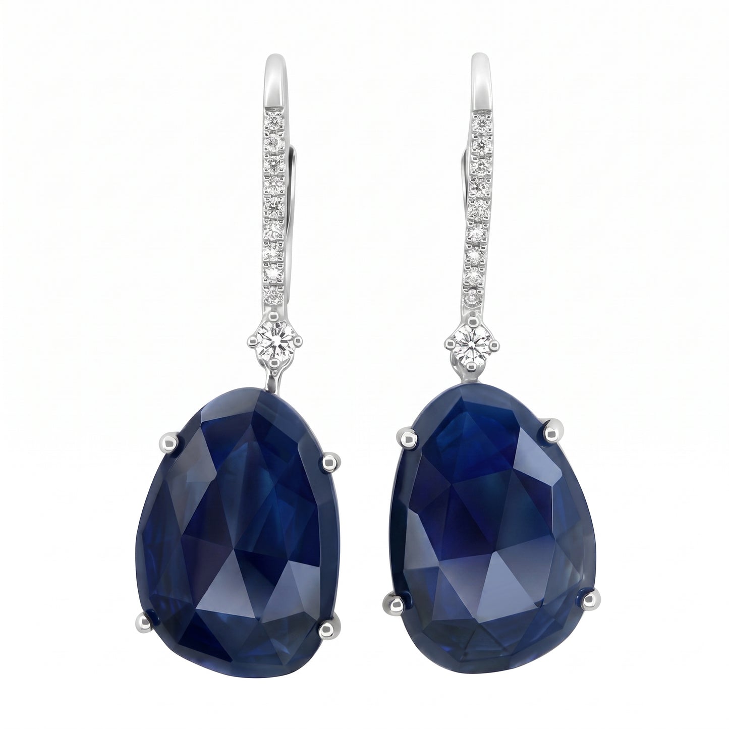 SEG0700W 14K white gold lever-back drop earrings with a large faceted free-form dark blue sapphire and a pave file of round diamonds, white background