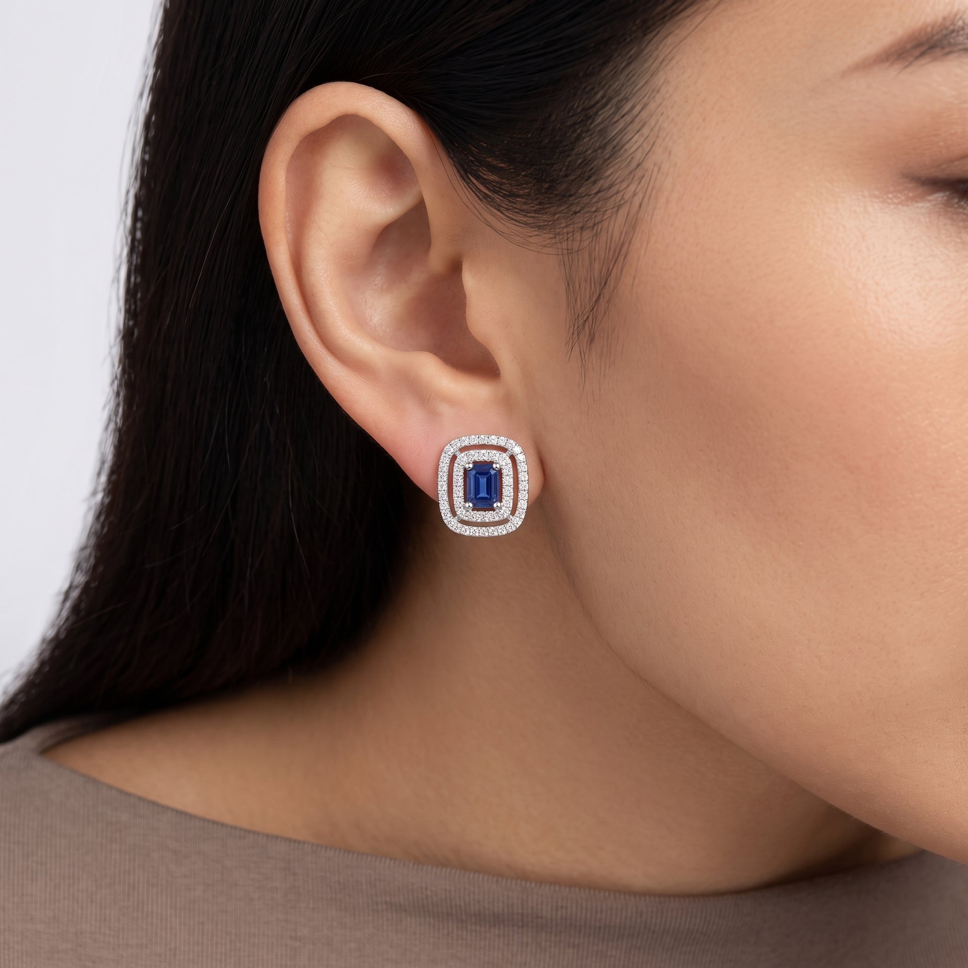 Model wearing Blue Sapphire Double Halo Diamond Stud Earring in 14K white gold