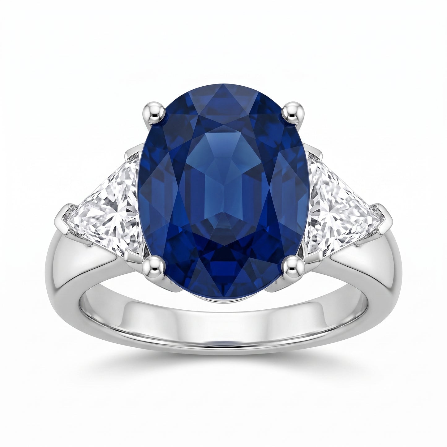 4.62ct Oval Sapphire Three-Stone Ring with Trillion Diamonds