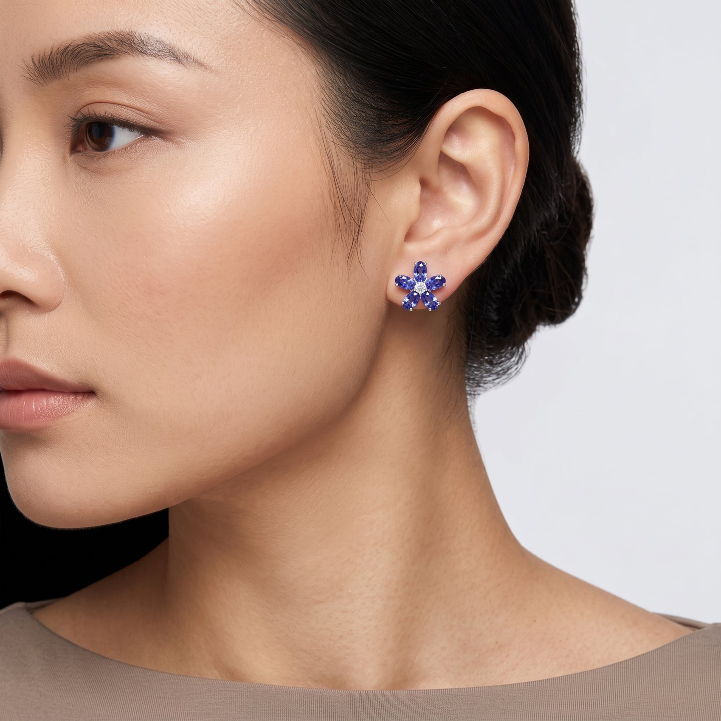 10 Oval 3x5mm Tanzanite & 2-Diamond Flower Post Earrings - on model